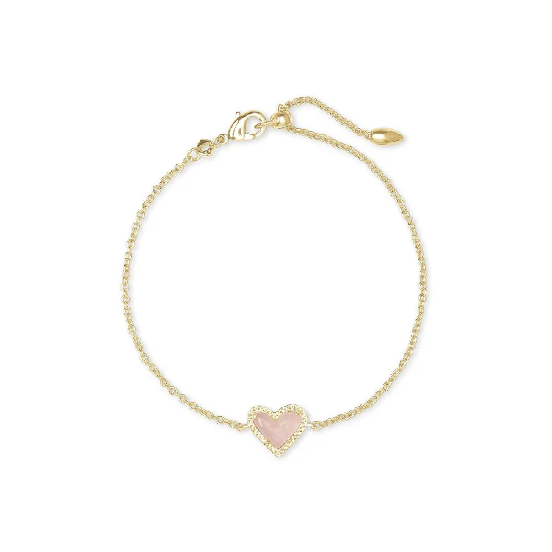 women layered bangles -Kendra Scott Ari Heart Gold Delicate Chain Bracelet in Rose Quartz